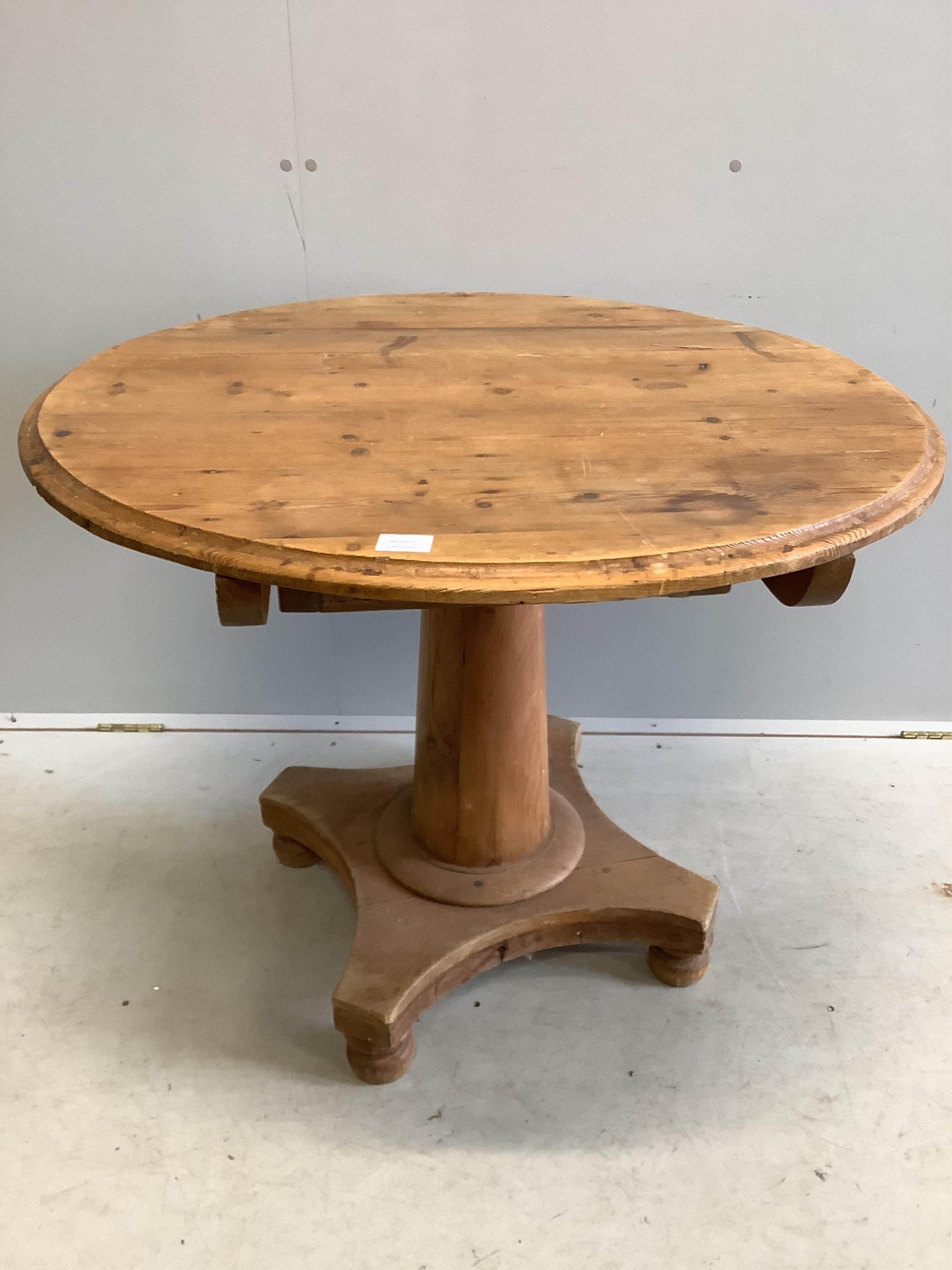 A 19th century Continental pine circular tilt top breakfast table, diameter 92cm, height 72cm. Condition - fair